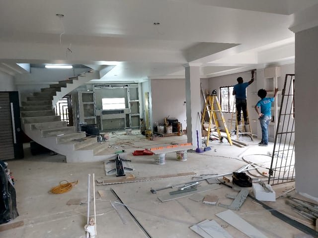 A Jamaal's Industrial crew fitting out a home interior, building joinery and finishing the walls